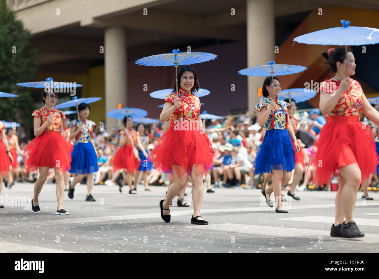 Indianapolis, Indiana, USA - May 26, 2018, Women wearing traditional chinese clothing and holding umbrellas from the Confucius Institute Indianapolis, Stock Photo