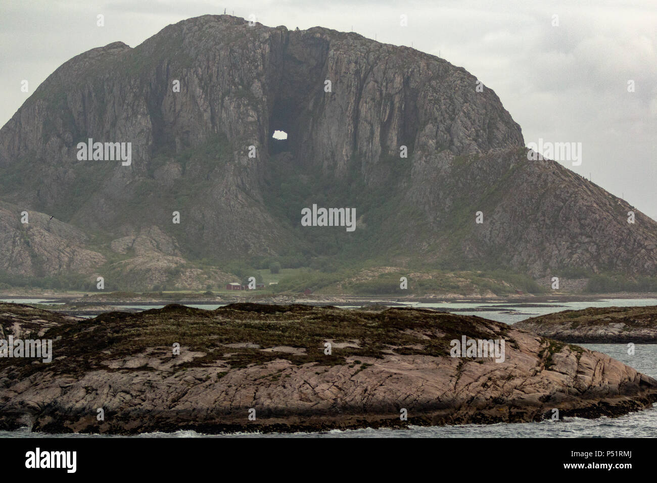 Torghatten Mountain and its distinctive hole going clear through the mountain Stock Photo