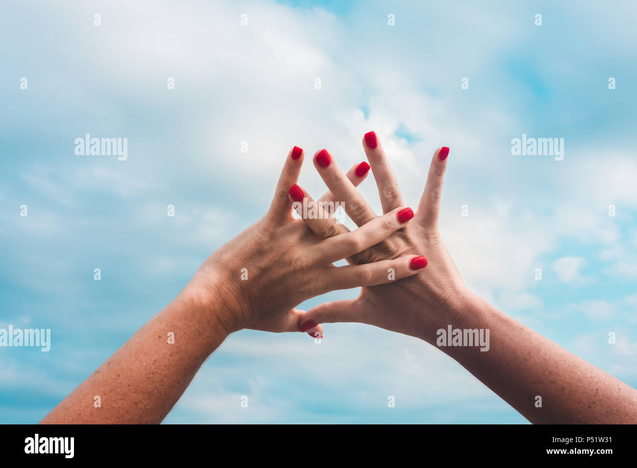 Raising hands Stock Photo