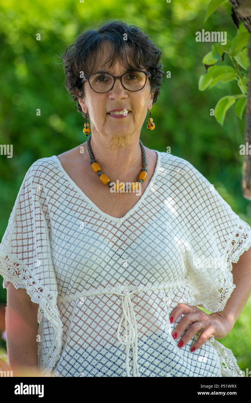 a portrait of a beautiful senior woman in the garden Stock Photo - Alamy