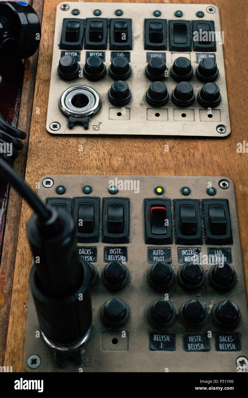 Nautical yacht cockpit. Closeup of a motorboat control panel with tachometer, fuel gage and