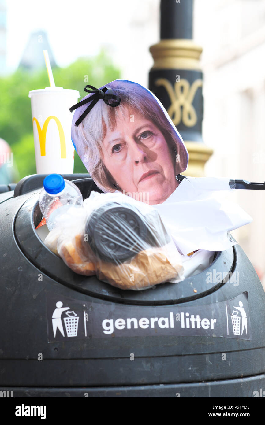 A face mask of Prime Minister Theresa May dumped in a rubbish litter bin in central London UK after the People's Vote march June 2018 Stock Photo