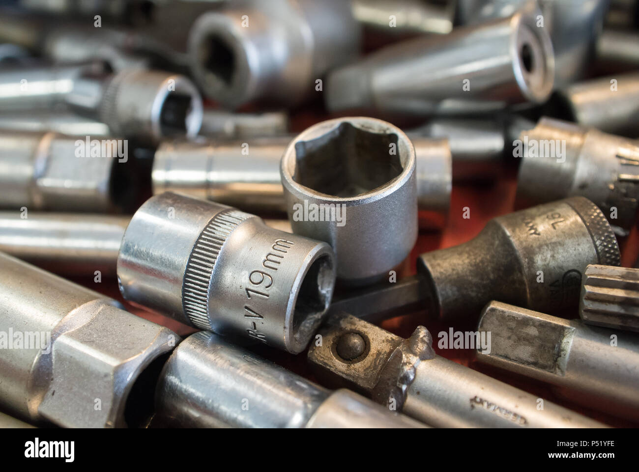 Spanner and nuts in a garage Stock Photo