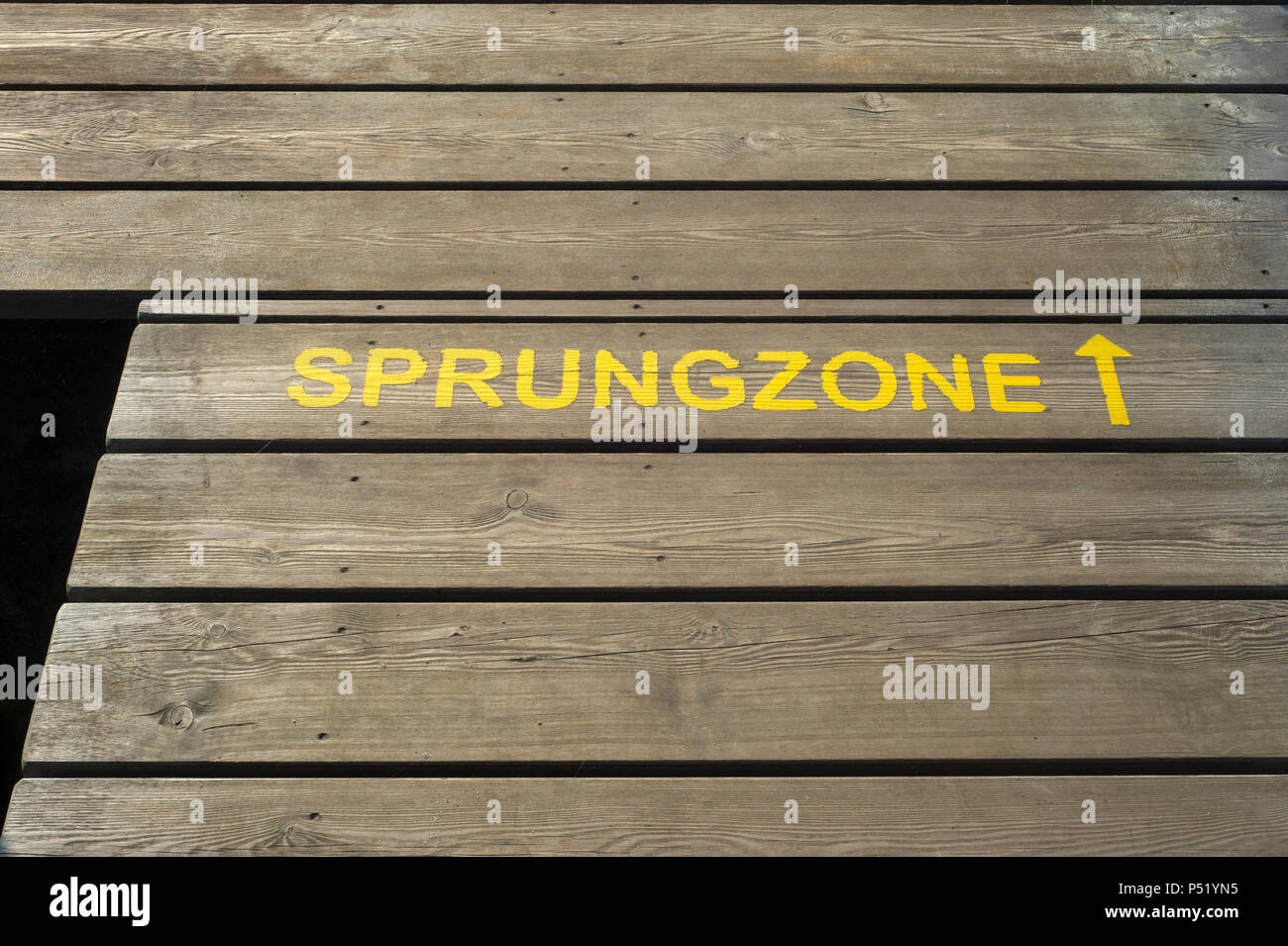 Wooden walkway with the inscription Sprungzone Stock Photo