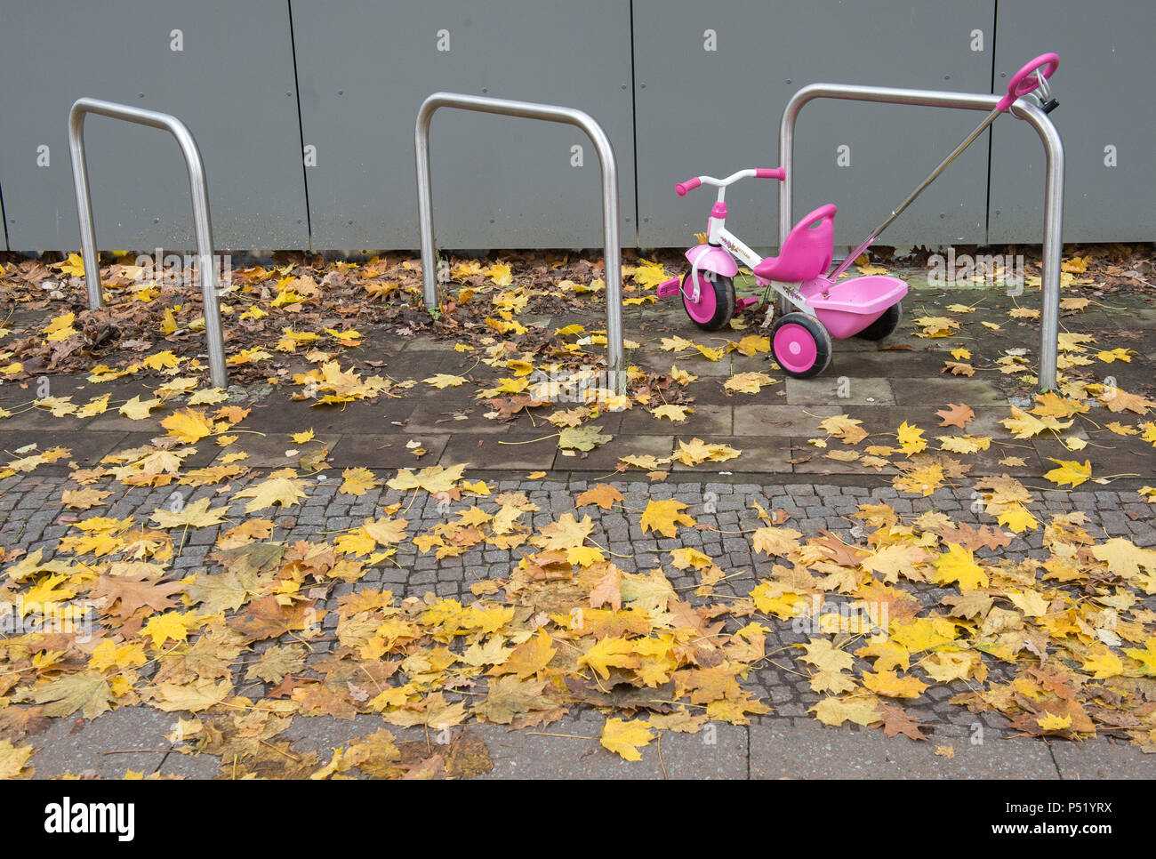 An attached tricycle for children before a daycare Stock Photo