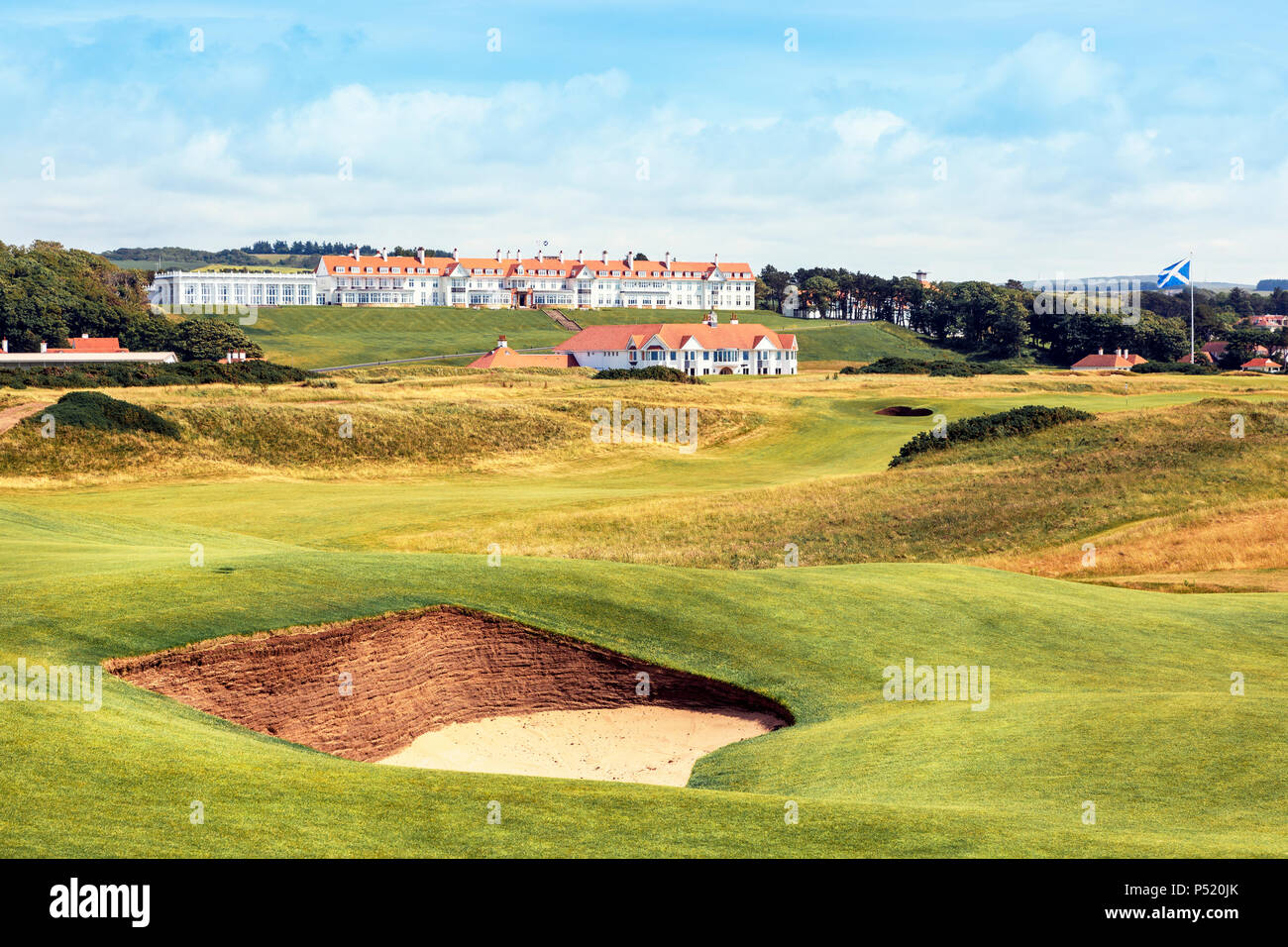 Trump Turnberry hotel and golf complex with a view towards the hotel and Clubhouse across the 5th fairway on the Ailsa Course, Turnberry, Ayrshire, Sc Stock Photo