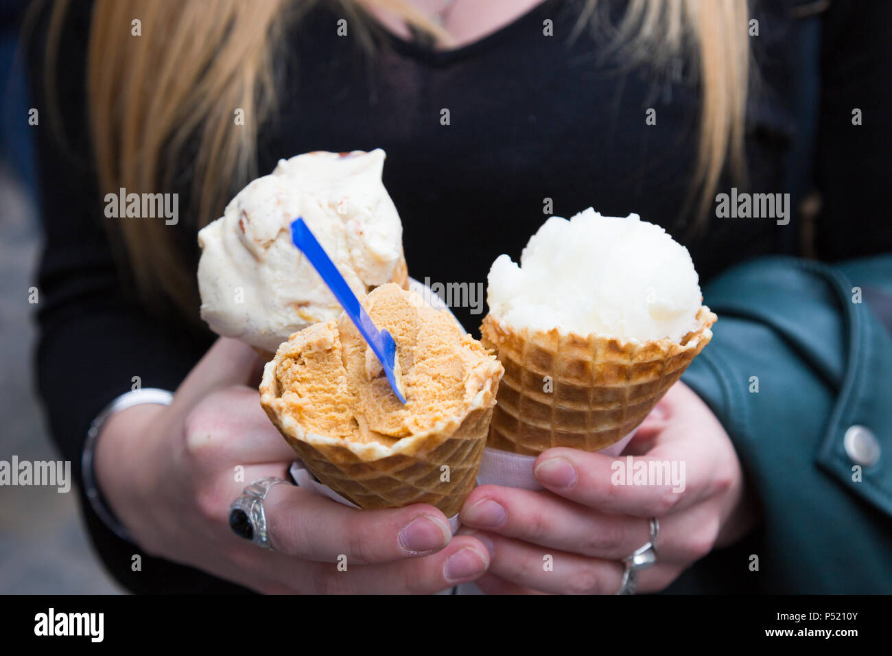 Girl holding ice cream cones Stock Photo