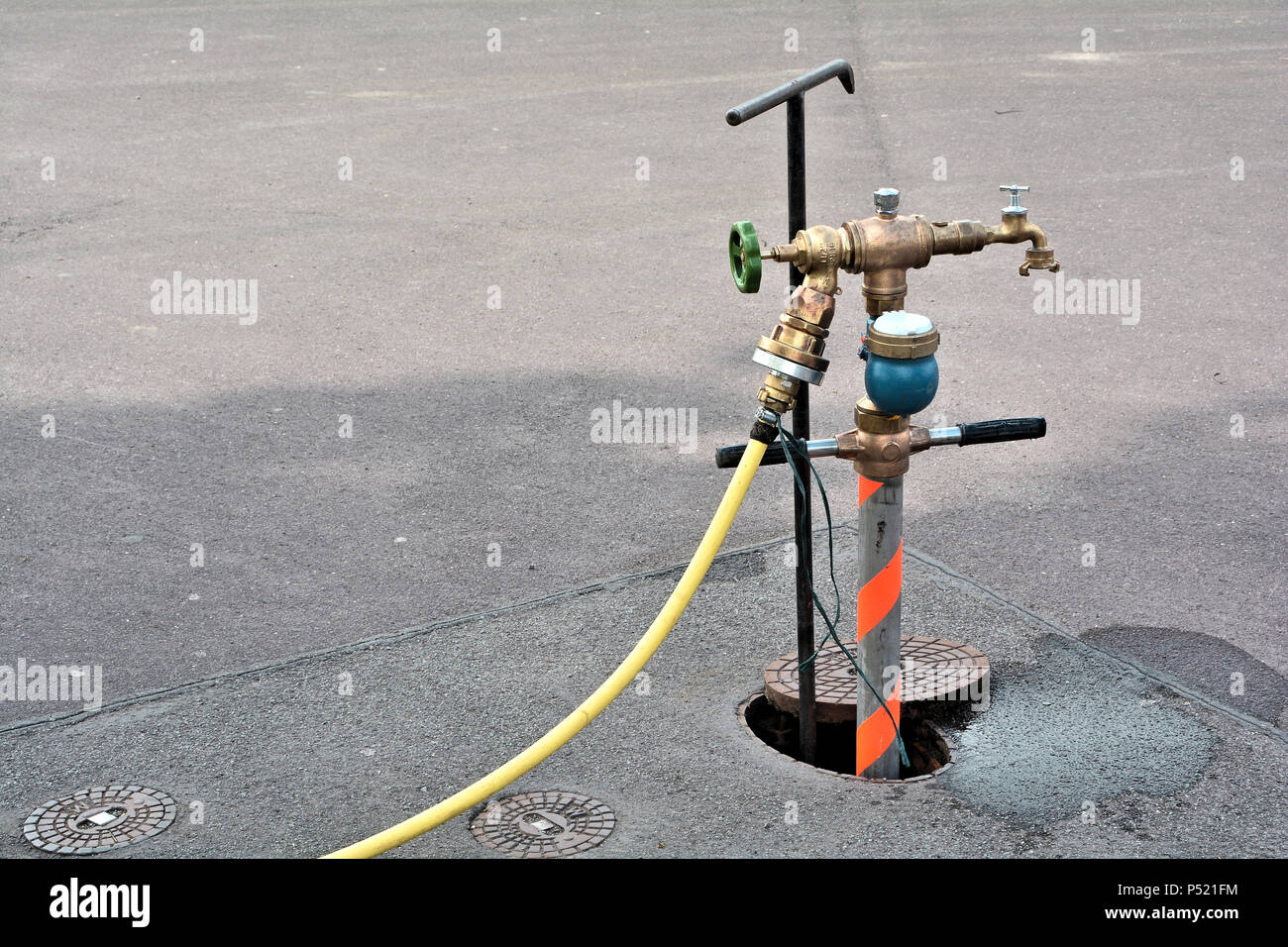 Water supply through a hydrant Stock Photo