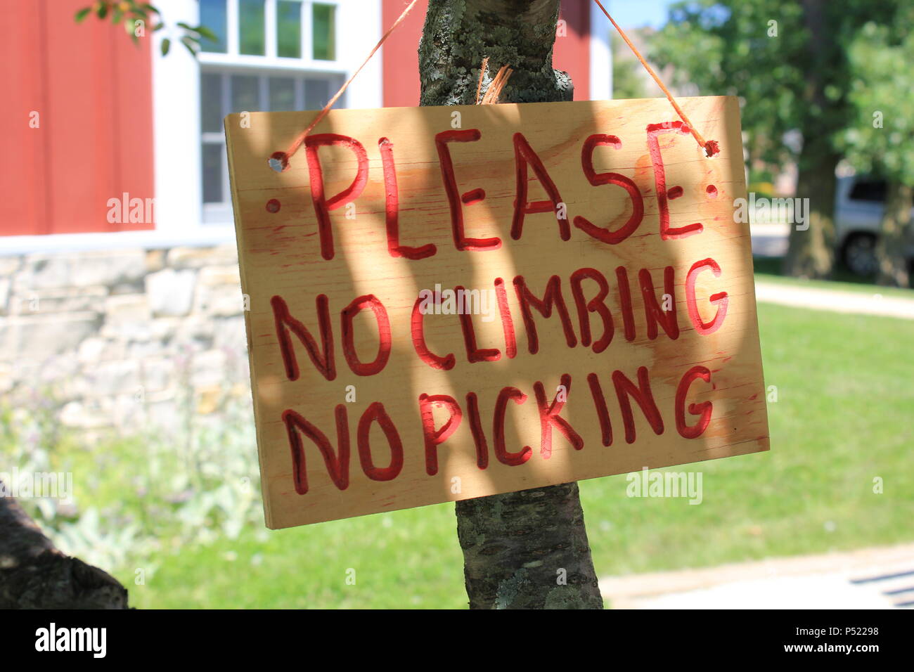 Please no climbing and no picking sign Stock Photo Alamy