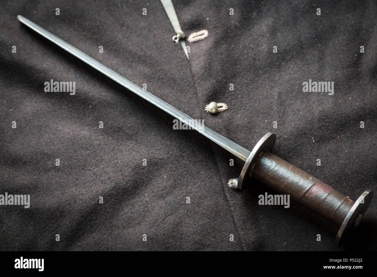 Man at arms, medieval rondel dagger and jacket Stock Photo