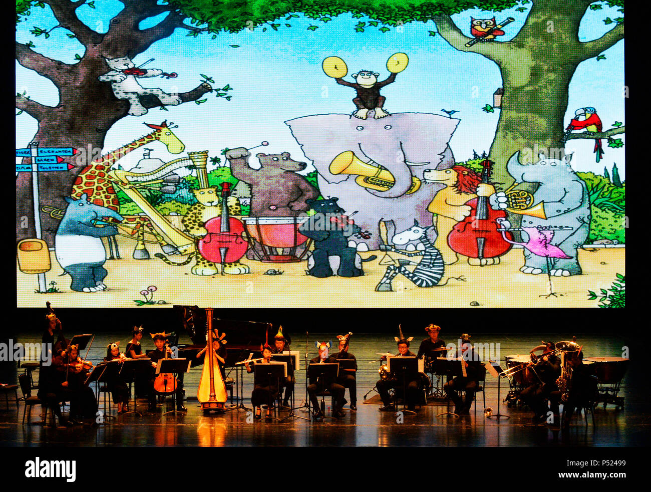 Tianjin. 23rd June, 2018. Members of a symphony orchestra stage an animal-themed concert for children and parents at Tianjin Grand Theatre in north China's Tianjin, June 23, 2018. Credit: Shi Songyu/Xinhua/Alamy Live News Stock Photo