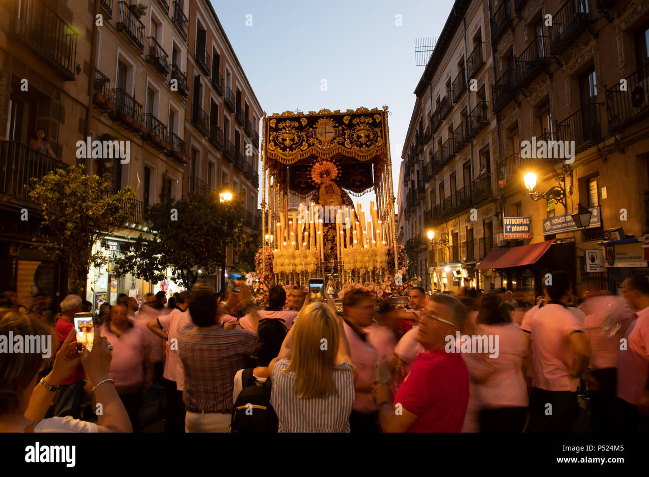 Madrid, Spain. 23rd June, 2018. People and tourist taking pictures of the Virgin 'Maria Santisima del Dulce Nombre en su Soledad' during a break of the procession at Mayor street. © Valentin Sama-Rojo/Alamy Live News. Stock Photo