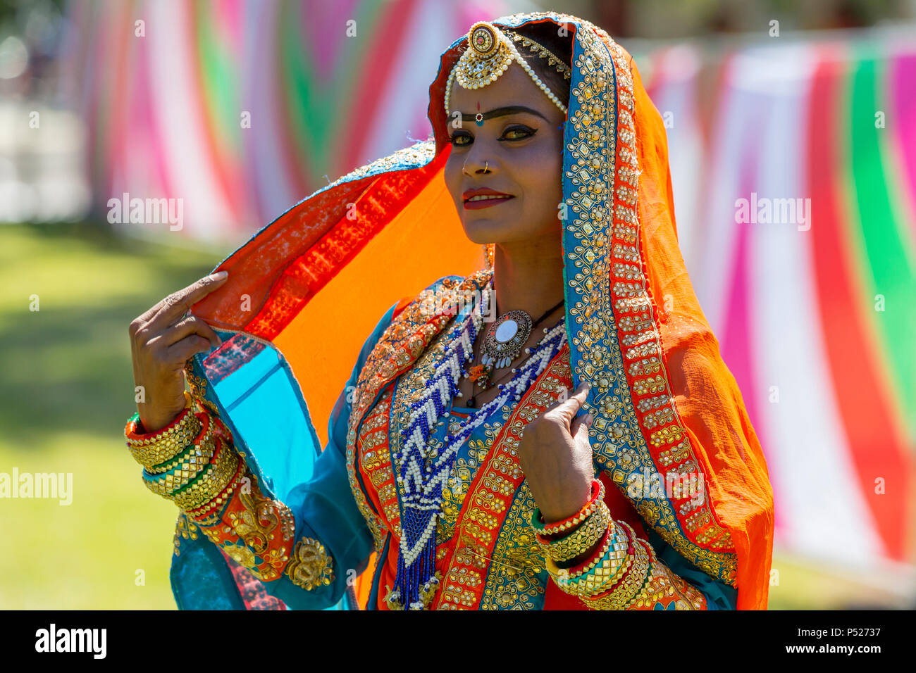 Glasgow, UK. 24th June, 2018. On a sunny summers day, thousands turned out to the annual Glasgow Mela held in Kelvingrove Park to enjoy a day of celebration of all aspects of Asian culture. There were many Asian bands and dance troops including the RAJASTAN HERITAGE BRASS BAND on their second appearance at the Mela and the GABHRU PANJAB DE Asian dance troop from Birmingham on their first appearance Credit: Findlay/Alamy Live News Stock Photo