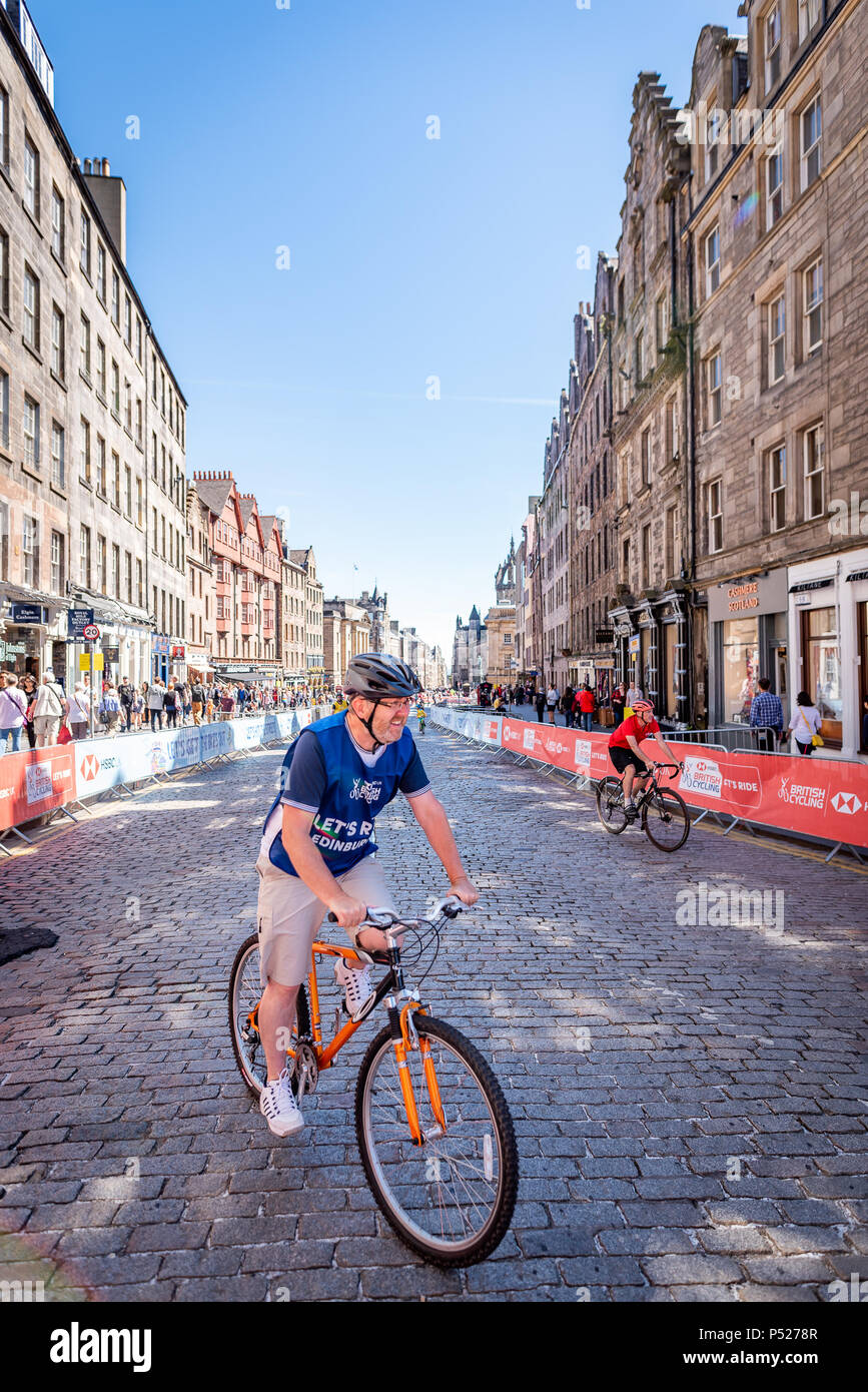 Edinburgh, Scotland. 24th June 2018. Participants at the HSBC UK Let’s Ride event in Edinburgh, Scotland, as part of the Edinburgh Festival of Cycling. Riders enjoyed a 4.5km closed road circuit of the historic city and a street festival set up in The Meadows public park with music, food and drink, fun and games, demos, giveaways and activities. Credit: Andy Catlin/Alamy Live News Stock Photo