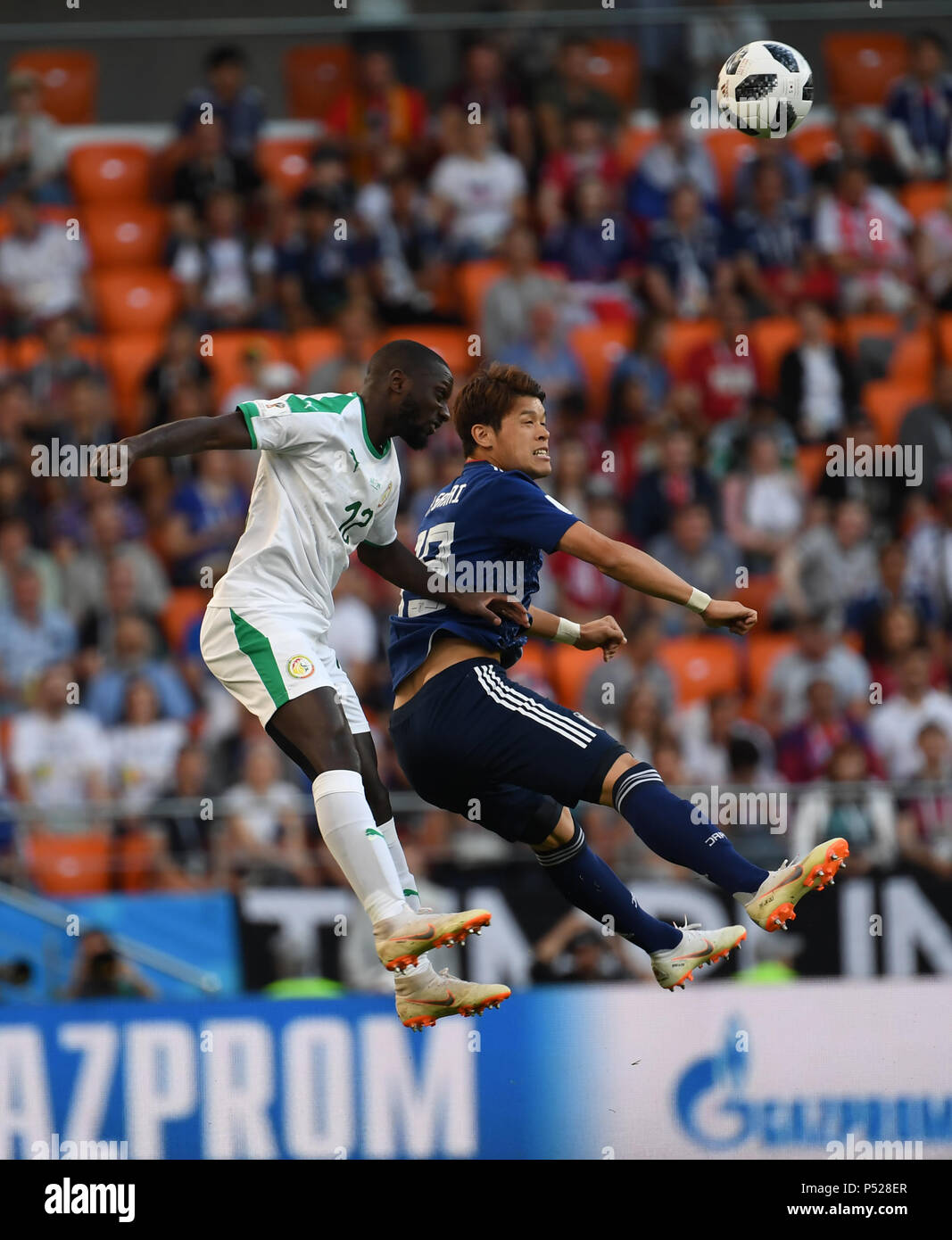 Yekaterinburg, Russia. 24th June, 2018. Hiroki Sakai (R) of Japan vies with Youssouf Sabaly of Senegal during the 2018 FIFA World Cup Group H match between Japan and Senegal in Yekaterinburg, Russia, June 24, 2018. Credit: Chen Cheng/Xinhua/Alamy Live News Stock Photo