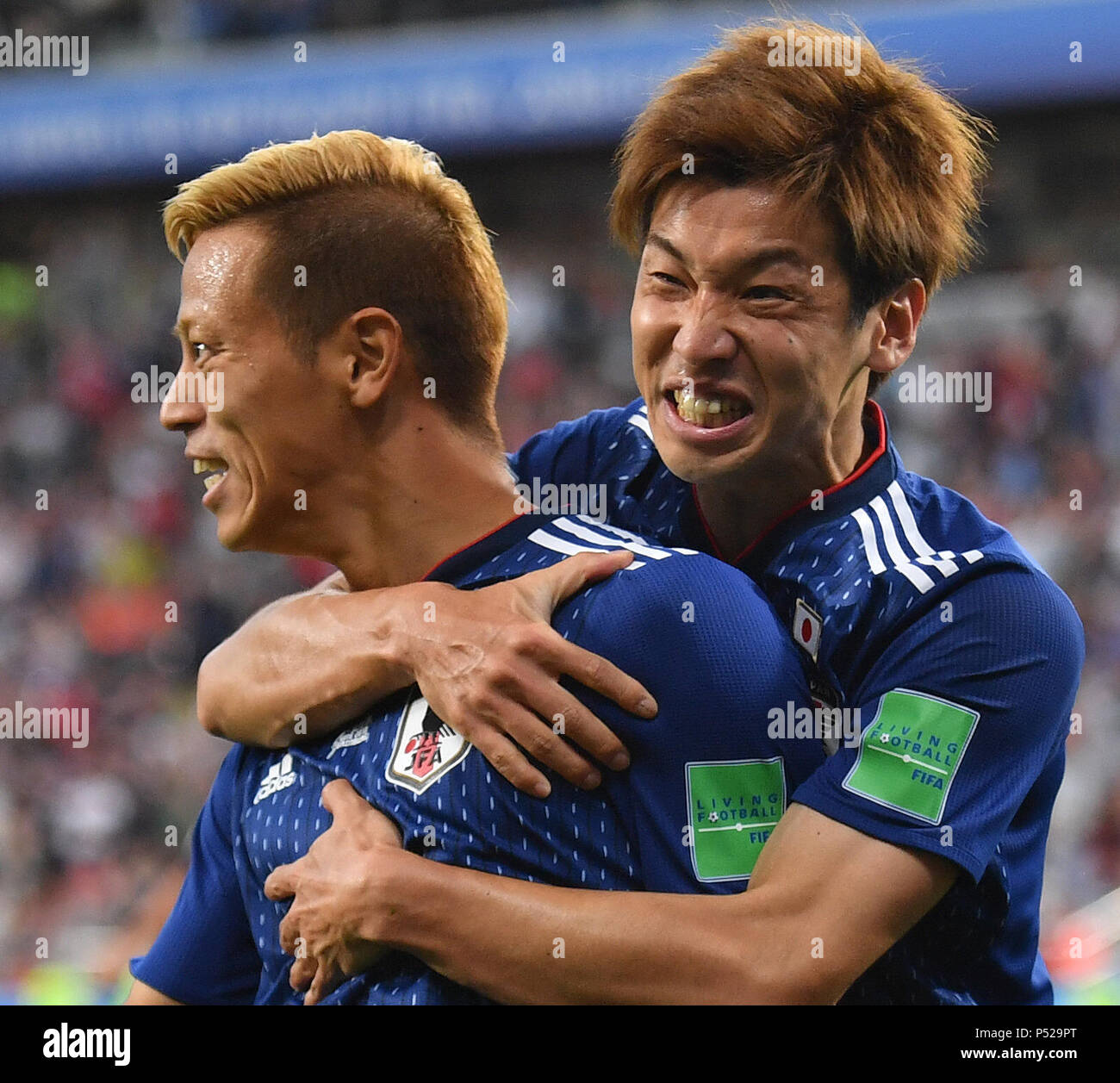 Yekaterinburg, Russia. 24th June, 2018. Keisuke Honda (L) of Japan celebrates his scoring with teammate during the 2018 FIFA World Cup Group H match between Japan and Senegal in Yekaterinburg, Russia, June 24, 2018. Credit: Liu Dawei/Xinhua/Alamy Live News Stock Photo