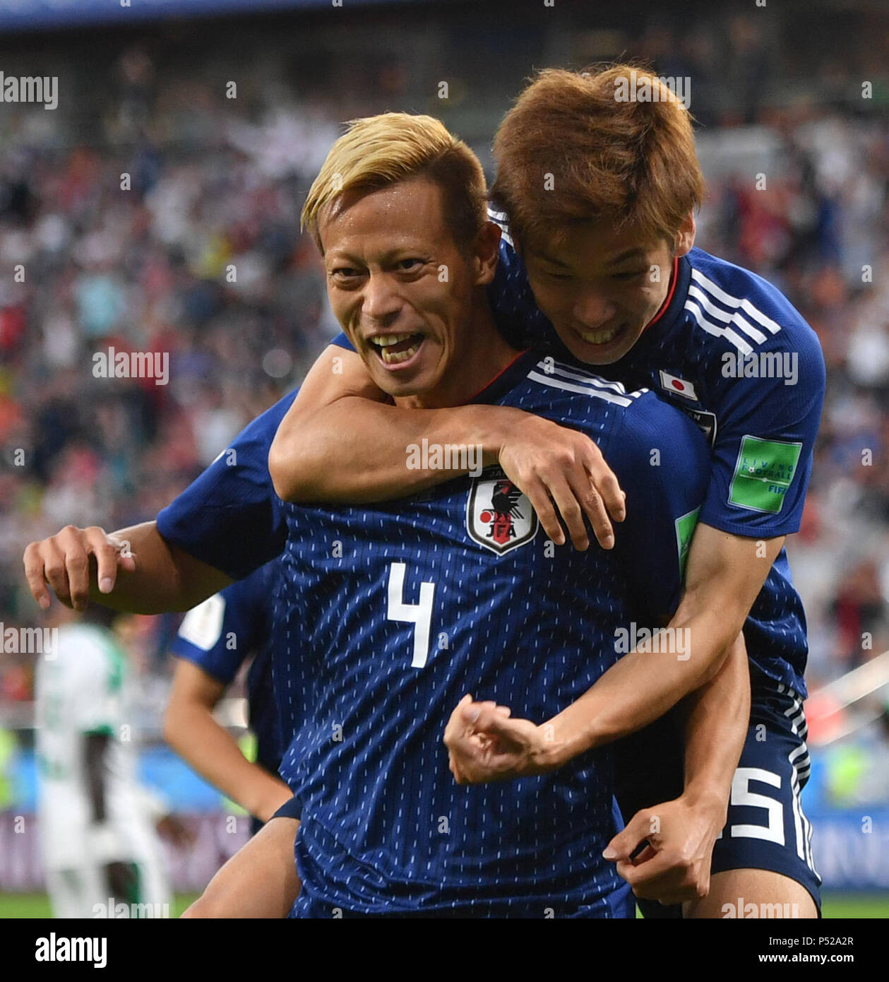 Yekaterinburg, Russia. 24th June, 2018. Keisuke Honda (bottom) of Japan celebrates his scoring during the 2018 FIFA World Cup Group H match between Japan and Senegal in Yekaterinburg, Russia, June 24, 2018. Credit: Liu Dawei/Xinhua/Alamy Live News Stock Photo