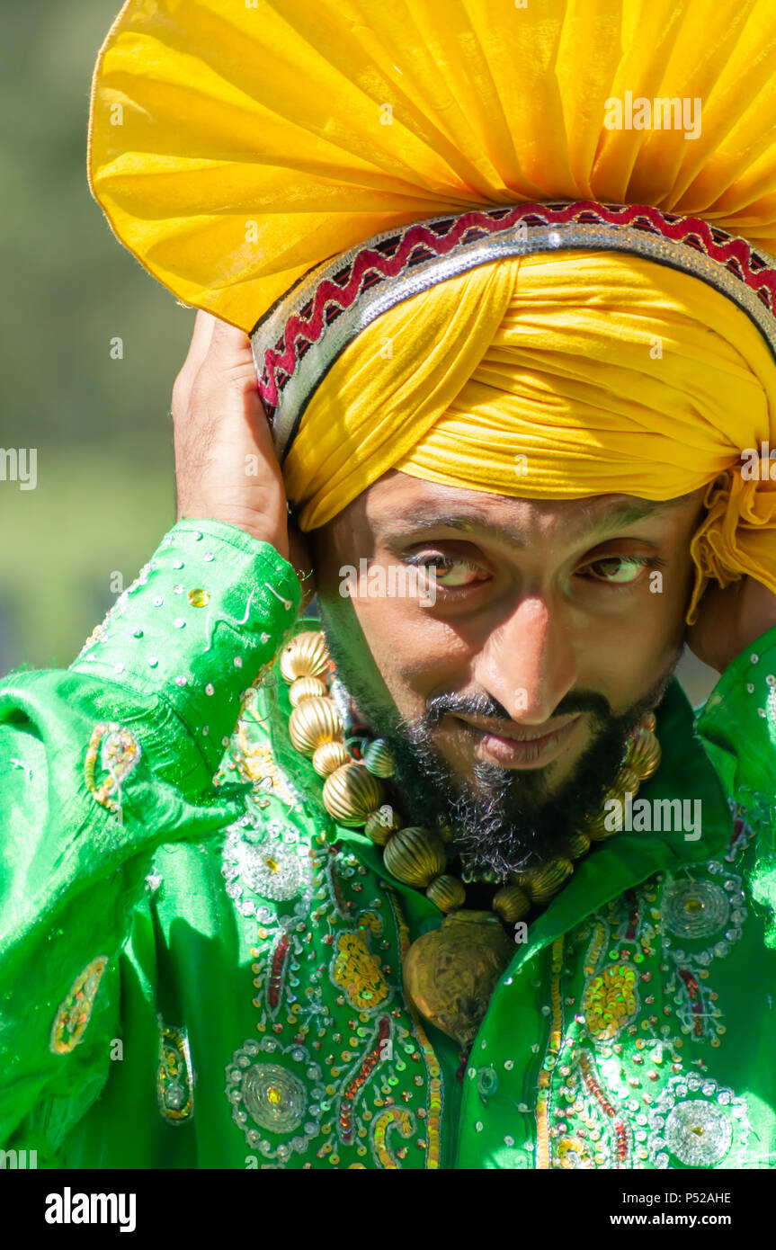 Glasgow, Scotland, UK. 24th June, 2018. A member of the traditional bhangra  dance group Gabhru Panjab De performing at Glasgow Mela, an annual  multicultural music festival held in Kelvingrove Park. This year's
