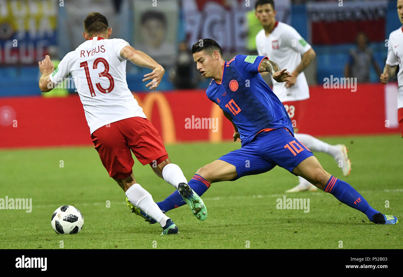 Kazan, Russia. 24th June, 2018. Maciej Rybus (L) of Poland vies with James Rodriguez of Colombia during the 2018 FIFA World Cup Group H match between Poland and Colombia in Kazan, Russia, June 24, 2018. Credit: He Canling/Xinhua/Alamy Live News Stock Photo