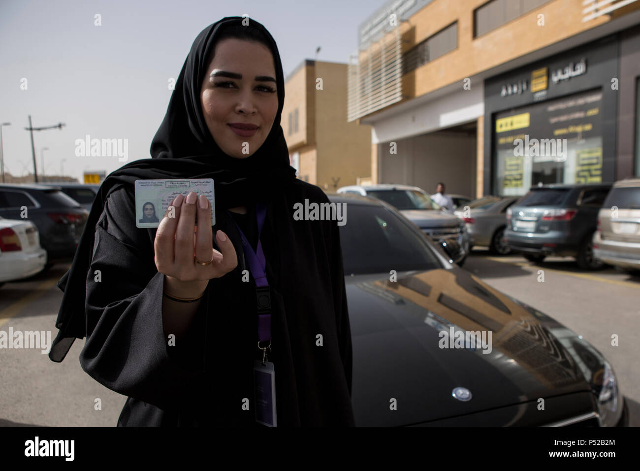 Saudi woman Gamela Aldakhel, poses with her new Saudi driving license, on the first day after lifting the driving ban on women, 24 June 2018. Women in Saudi Arabia got behind the wheel on Sunday after a decades-long ban was lifted as part of a liberalization drive in the conservative kingdom. Photo: Gehad Hamdy/dpa Credit: dpa picture alliance/Alamy Live News Stock Photo