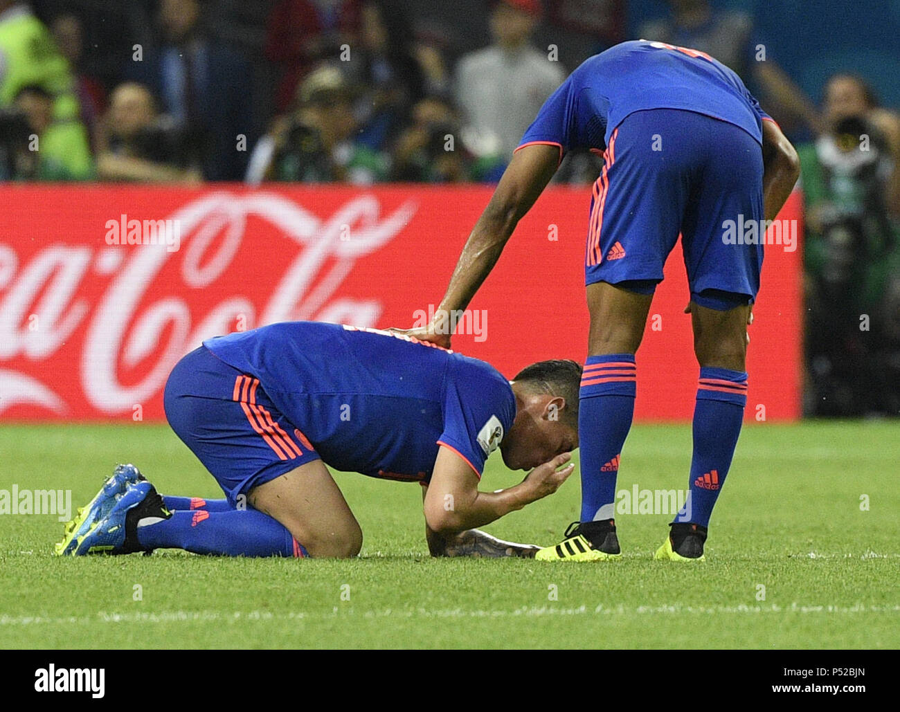 Kazan, Russia. 24th June, 2018. James Rodriguez (L) of Colombia sustains injury during the 2018 FIFA World Cup Group H match between Poland and Colombia in Kazan, Russia, June 24, 2018. Credit: Lui Siu Wai/Xinhua/Alamy Live News Stock Photo