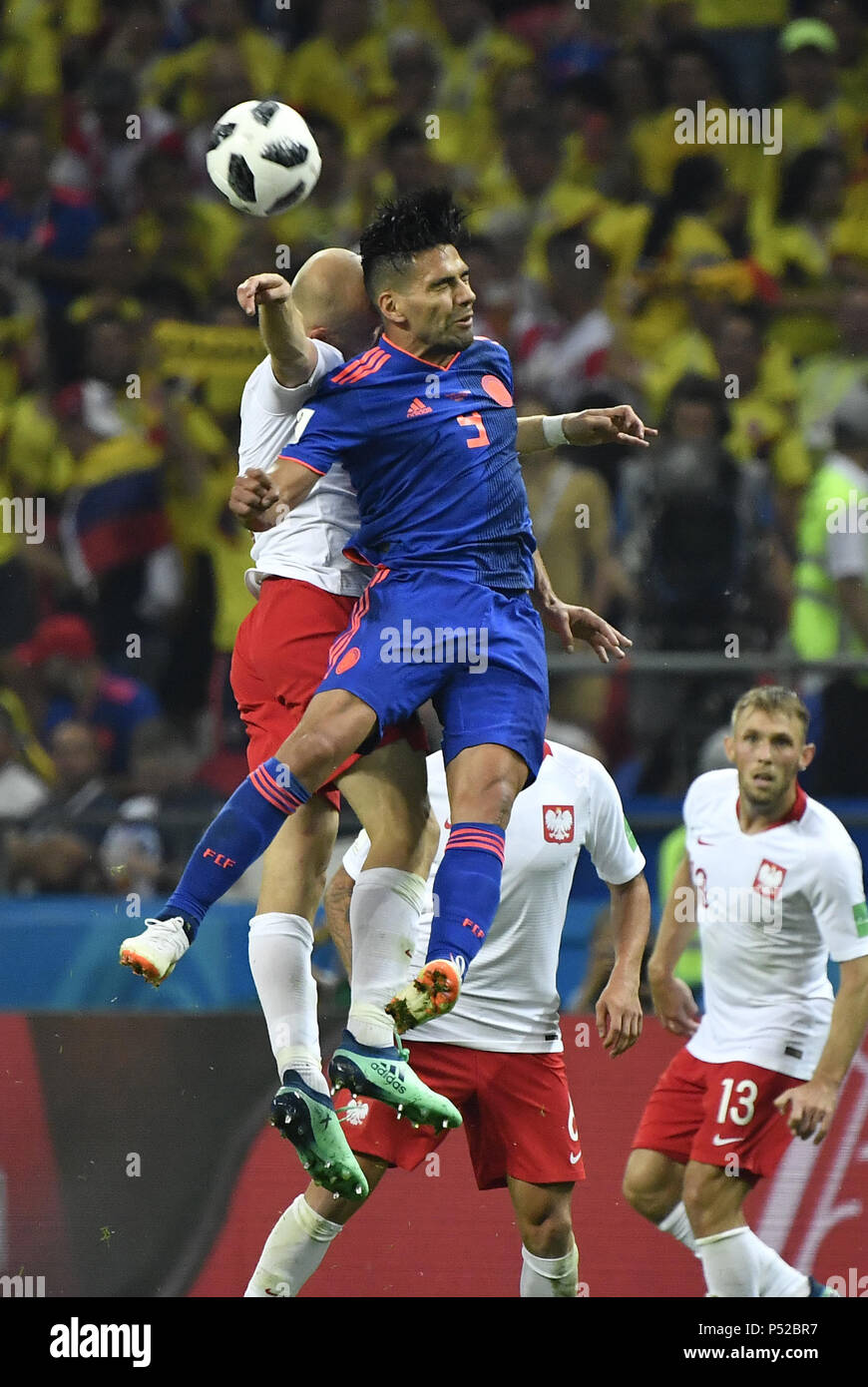 Kazan, Russia. 24th June, 2018. Radamel Falcao (R top) of Colombia competes for a header during the 2018 FIFA World Cup Group H match between Poland and Colombia in Kazan, Russia, June 24, 2018. Credit: He Canling/Xinhua/Alamy Live News Stock Photo