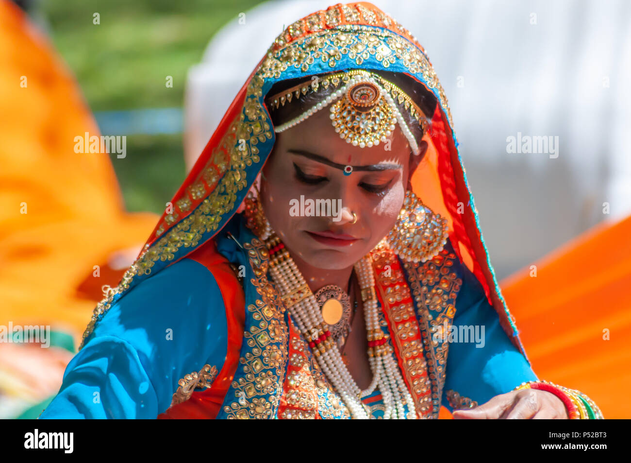 Glasgow, Scotland, UK. 24th June, 2018. A member of D & F Bros Grand Indian  Circus performing at Glasgow Mela, an annual multicultural music festival  held in Kelvingrove Park. This year's performers
