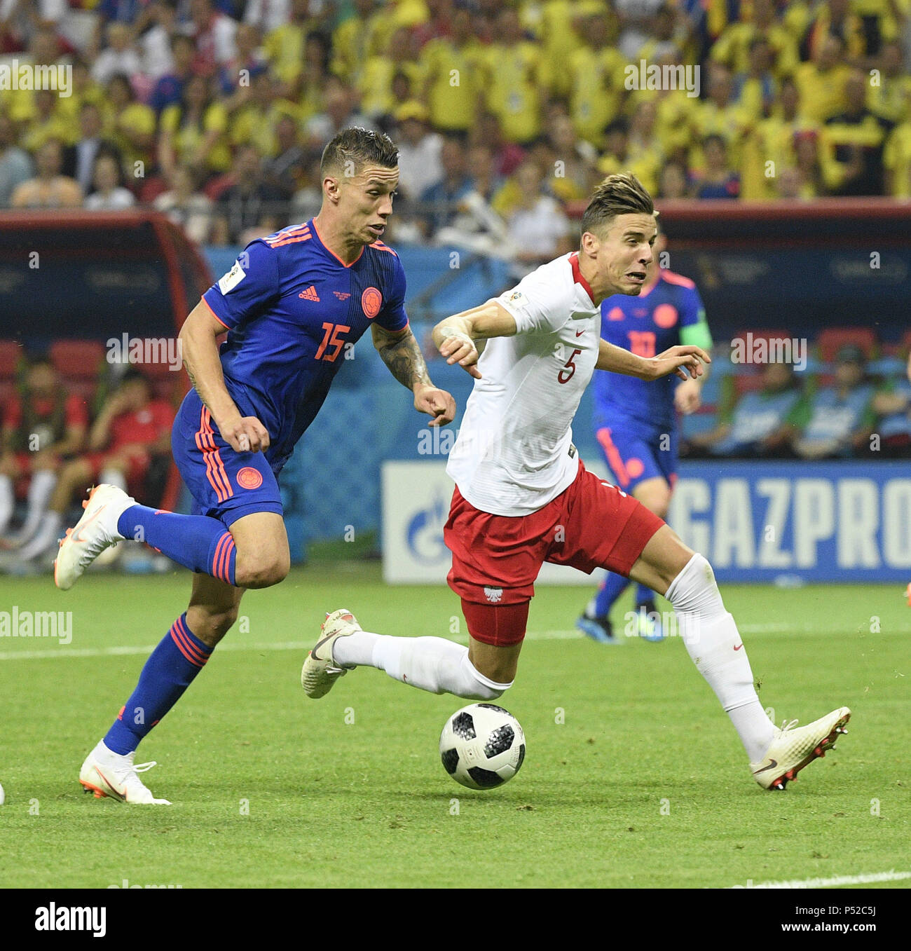 Kazan, Russia. 24th June, 2018. Mateus Uribe (L) of Colombia competes during the 2018 FIFA World Cup Group H match between Poland and Colombia in Kazan, Russia, June 24, 2018. Colombia won 3-0. Credit: Lui Siu Wai/Xinhua/Alamy Live News Stock Photo