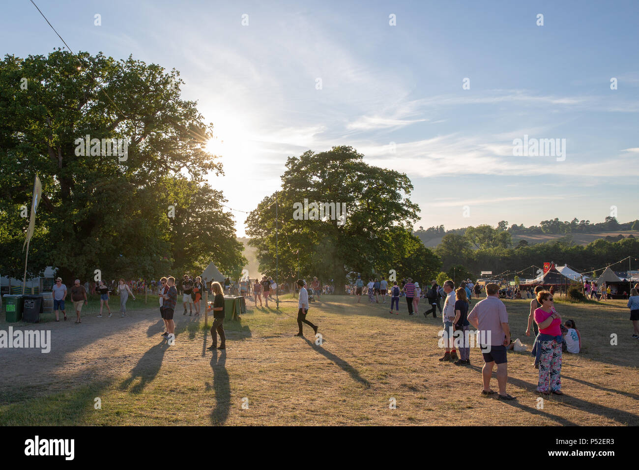 Tunbridge Wells, UK. 24th June, 2018 Festival goers enjoying the evening sun at the Black Deer Festival, Eridge Park, Kent  UK..© Jason Richardson / Alamy Live News Stock Photo