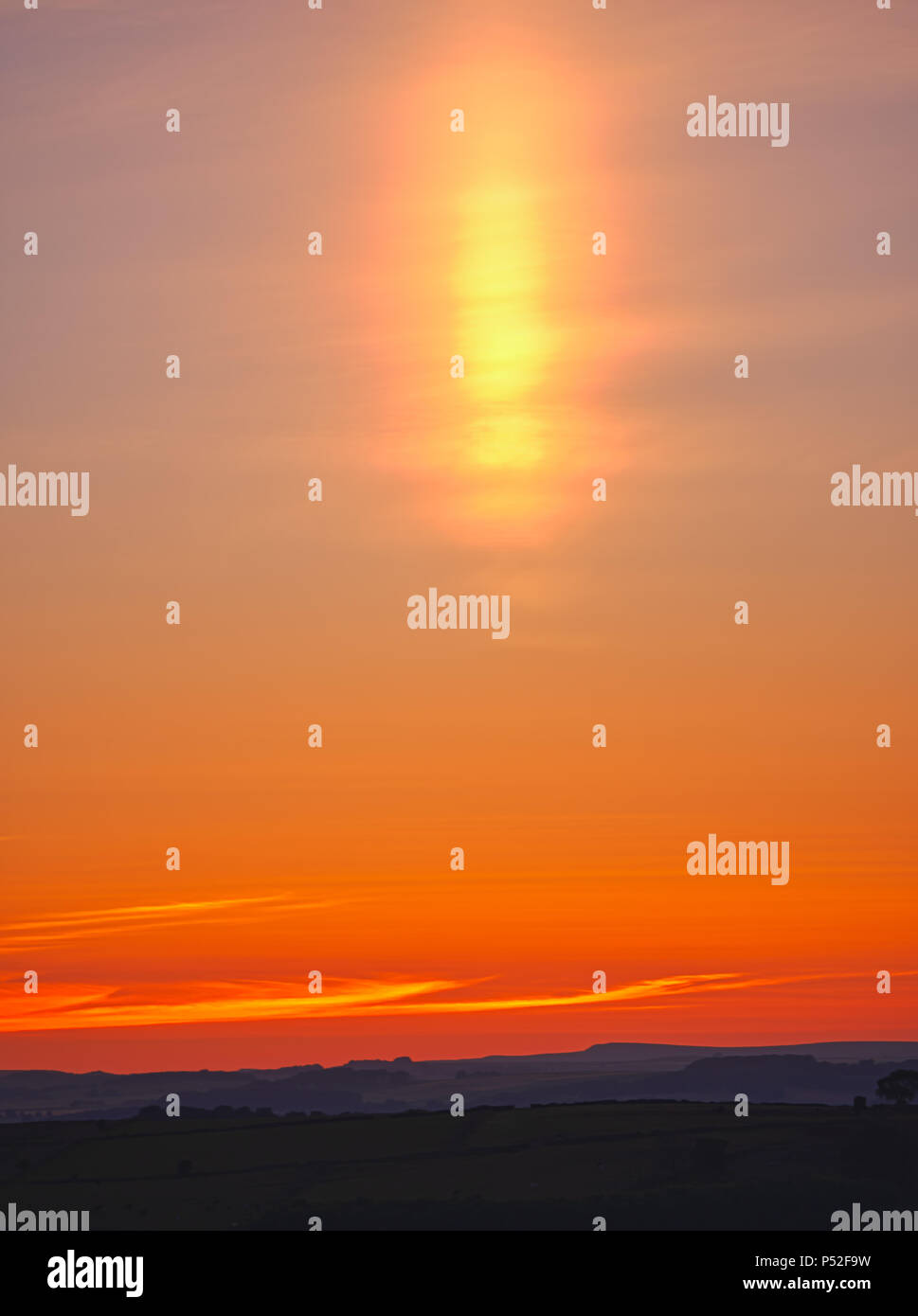 Brassington, Derbyshire, UK. 24th June, 2018. Weather UK: sun pillar solar column during an amazing sunset at Harborough Rocks near Brassington & the High Peak Trail, Derbyshire, Peak District National Park Credit: Doug Blane/Alamy Live News Stock Photo