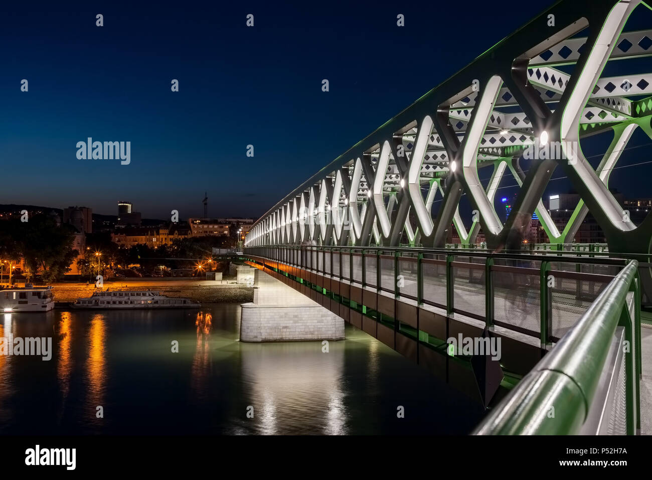 Old Bridge (Stary most) over Danube river in Bratislava city at night in  Slovakia, construction with pathway for pedestrians, bike lane and trams  trac Stock Photo - Alamy