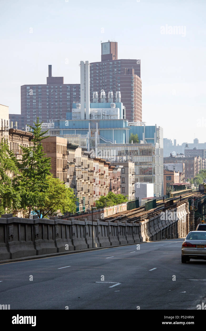 Manhattan, New York USA. View looking across railroad tracks to 125th Street Station, apartment buildings and the Jerome L Green Science Center. The b Stock Photo