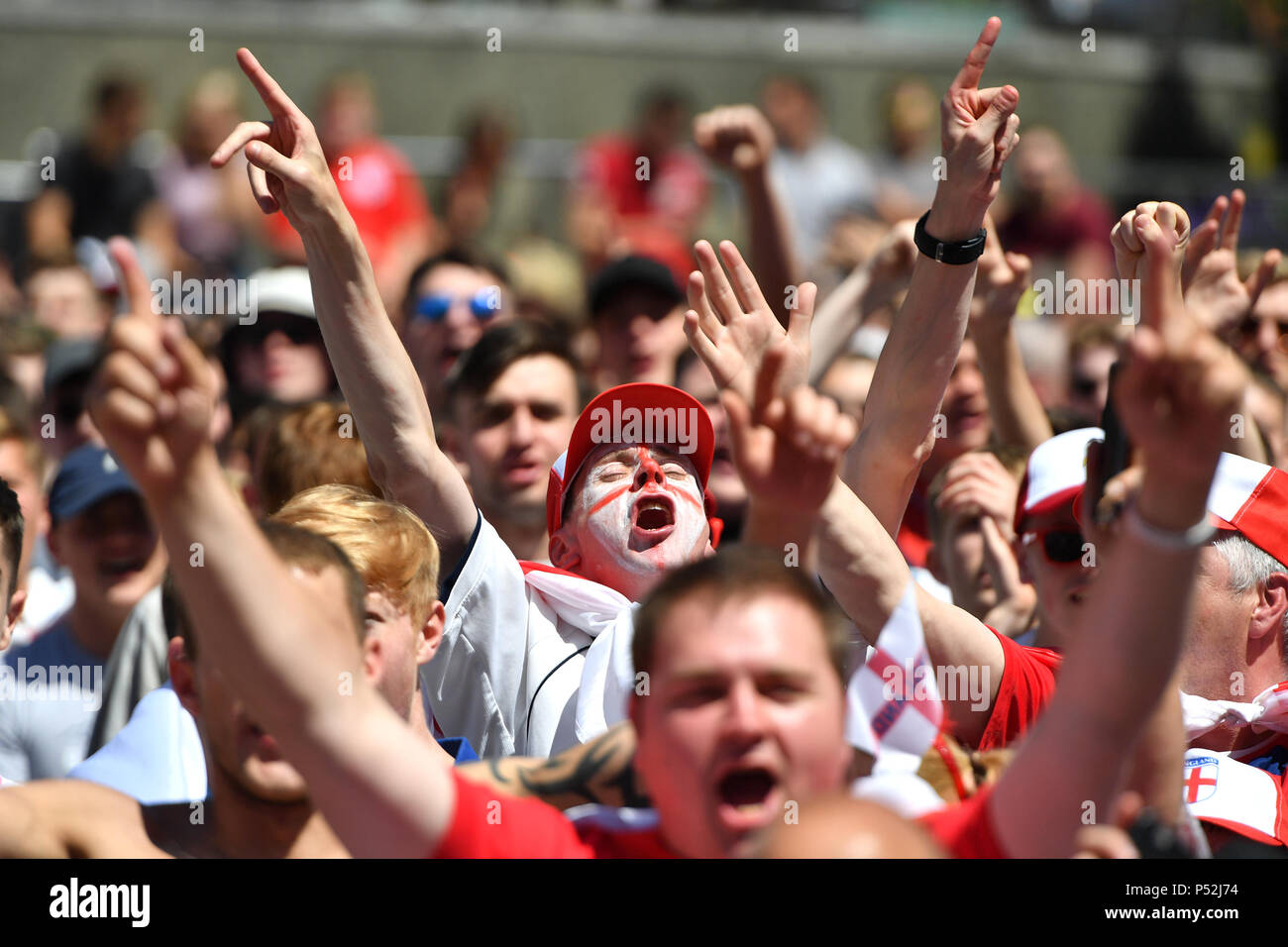 Fans sing the national anthem as they watch the England v Panama World
