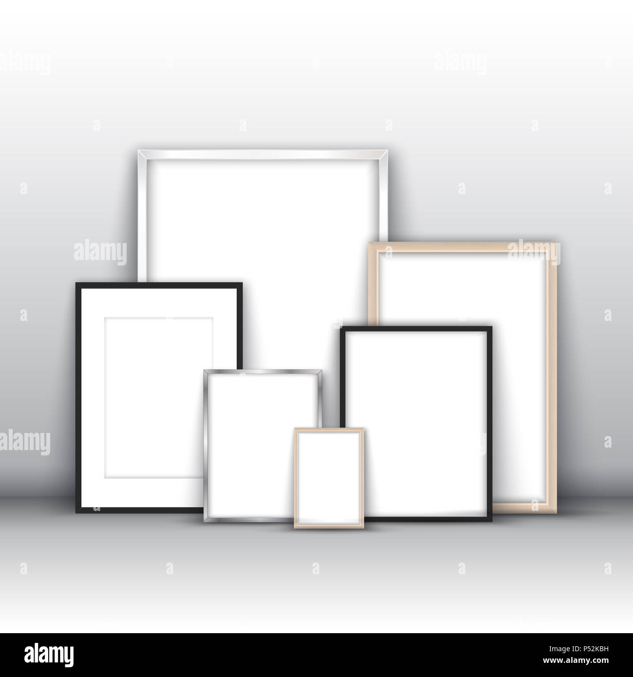 Blank picture frames leaning against a wall Stock Photo Alamy