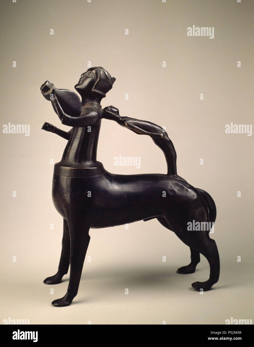 Madrid, M.A.N. 52851. Arte Edad Media.Aguamanil con forma de centauro tocando la viola. Bronce. s.XIV. Stock Photo