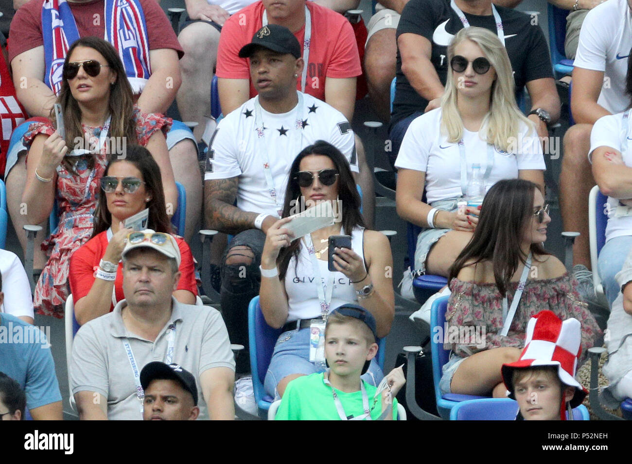 Rebekah Vardy (left, second row), wife of England's Jamie Vardy and Annabel Peyton (top right), fiancee of England goalkeeper Jack Butland, during the FIFA World Cup Group G match at the Nizhny Novgorod Stadium. Stock Photo