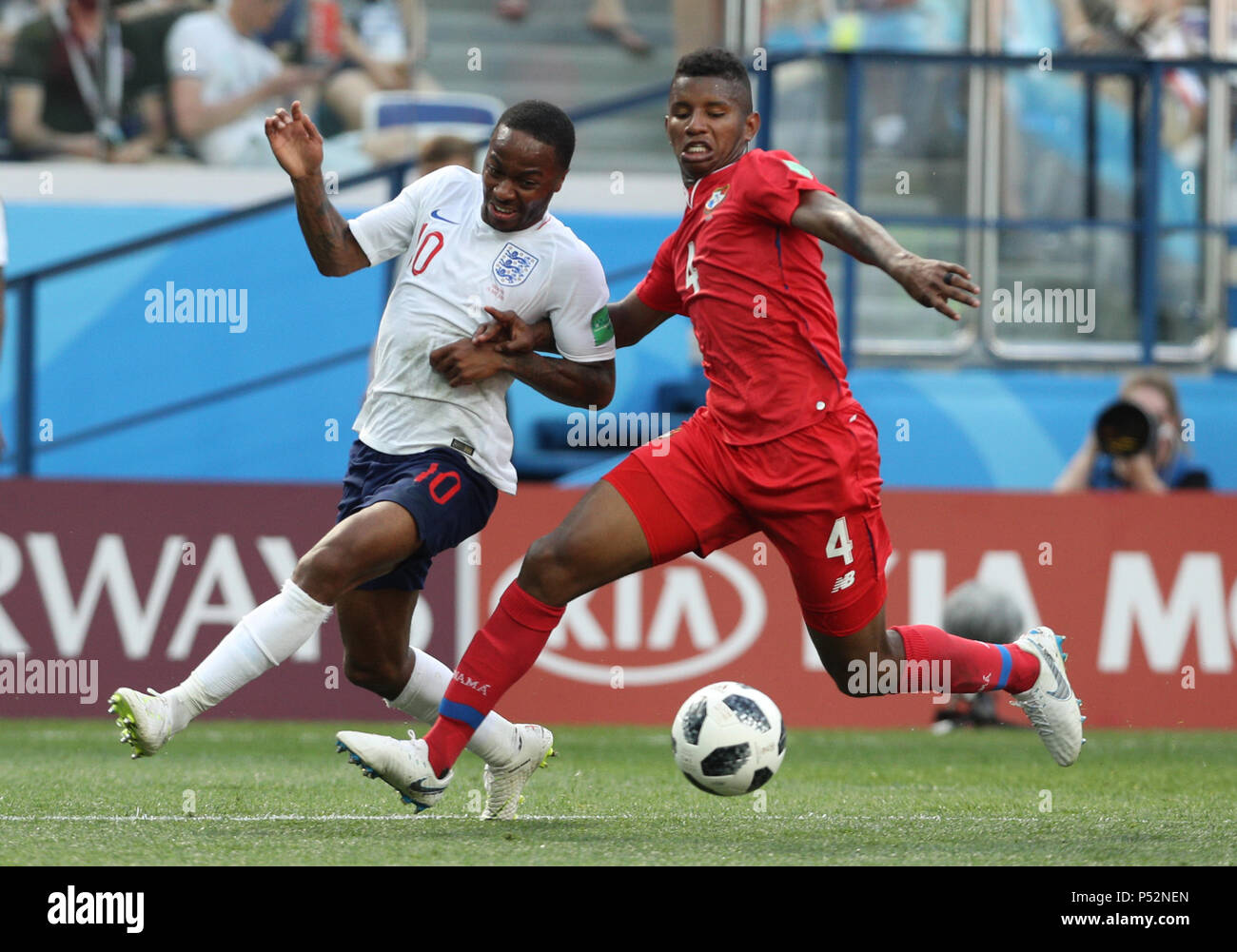 England's Raheem Sterling (left) and Panama's Fidel Escobar battle for the ball during the FIFA World Cup Group G match at the Nizhny Novgorod Stadium. Stock Photo