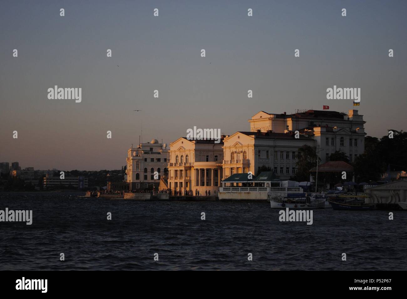 Ukraine. Sevastopol. Klokachev Quay (House of Children and Youth). View at sunset. Crimean Peninsula. Stock Photo