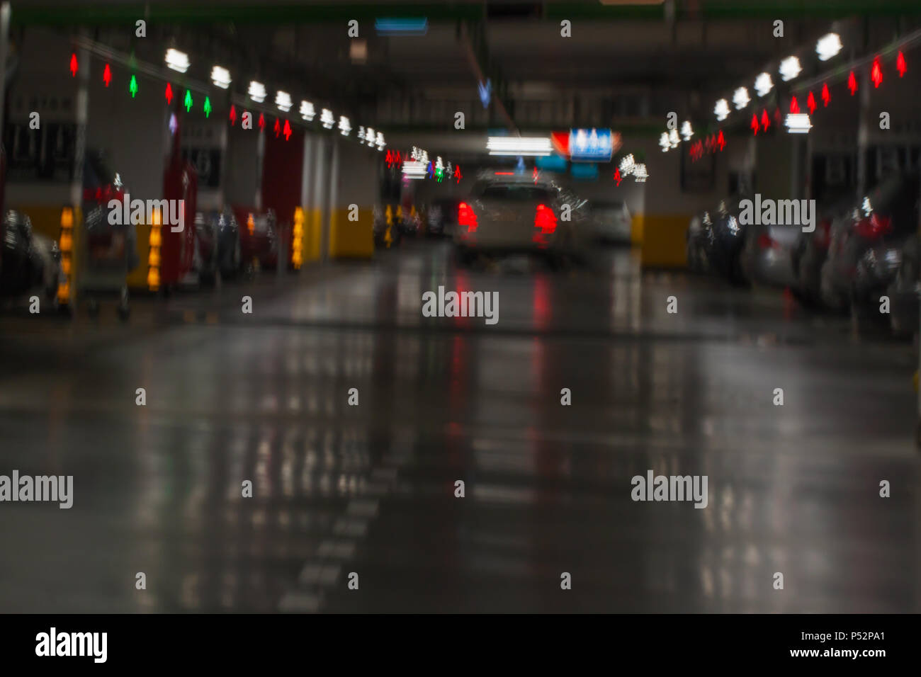 Underground parking garage with cars, blur Stock Photo - Alamy