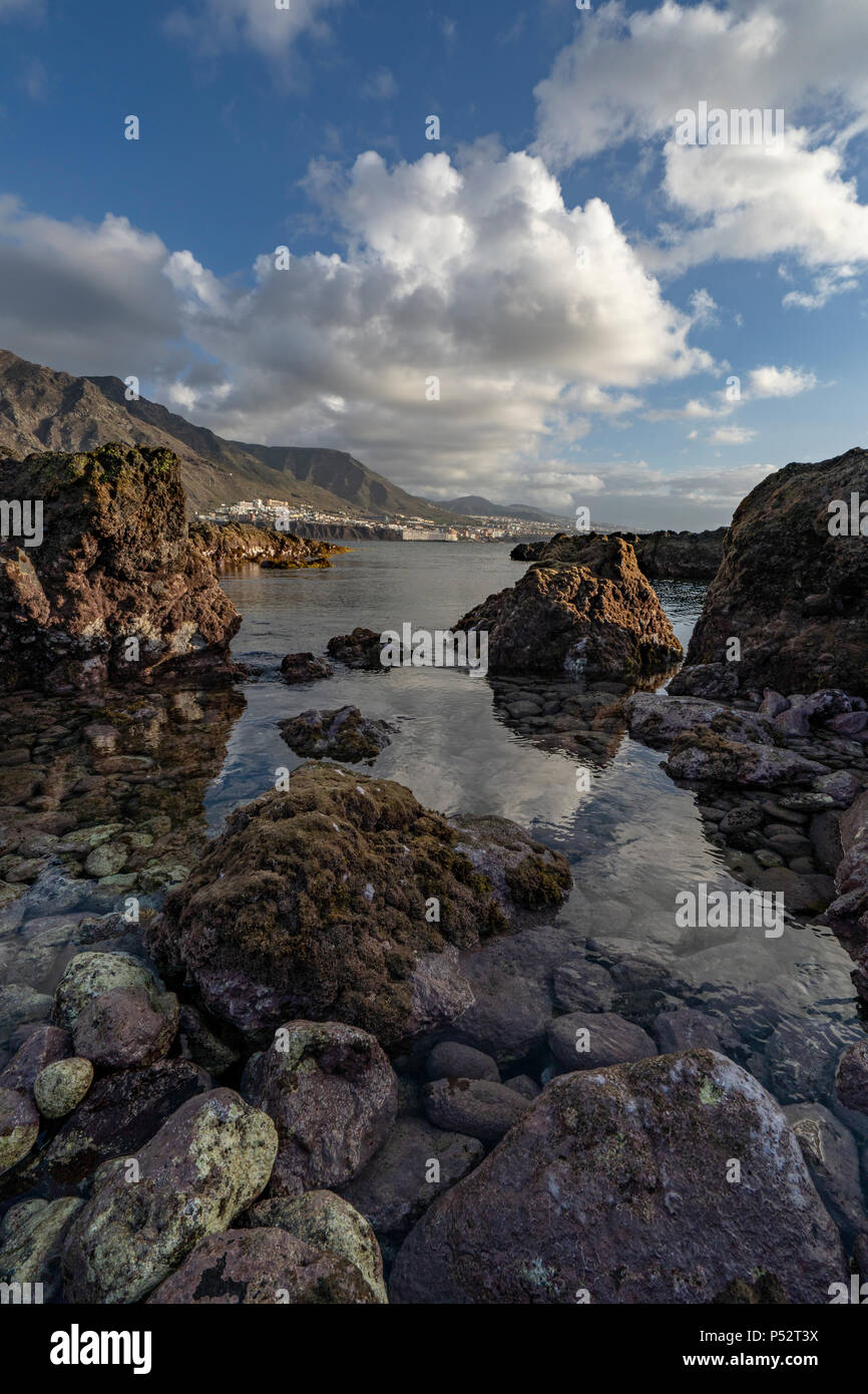 Punta del Hidalgo, Tenerife. Sun setting over Natural Pools in Punta del Hidalgo Stock Photo