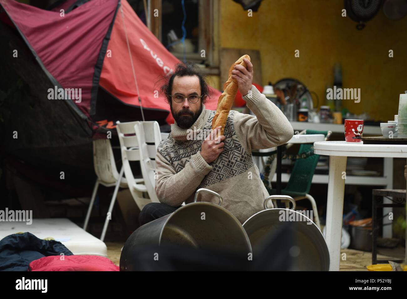 February 7, 2017 - Breil-sur-Roya, France: Portrait of Cedric Herrou, posing for a humorous video in which he jokes that his only weapons are bread, tents, and cooking pots.  Cedric Herrou pose pour une video humoristique dans laquelle il plaisante au sujet de ses seules armes pour aider les migrants: du pain, des tentes, et des casseroles. Stock Photo