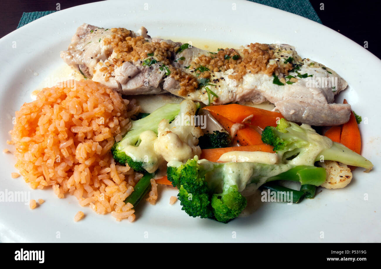 Pacific coast mahi-mahi, served with vegetables and rice Stock Photo