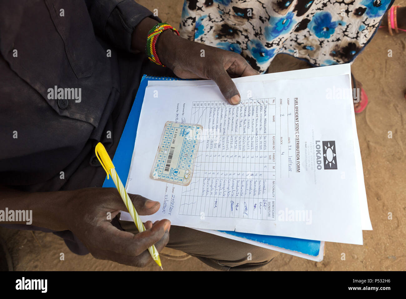 Kakuma, Kenya - Name matching with the help of a UNHCR refugee card in the Kakuma refugee camp. Stock Photo