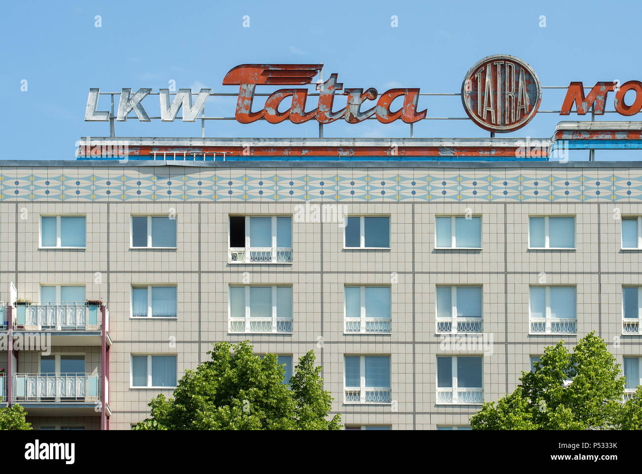 Historic advertising from GDR times for trucks TATRA on a prefabricated building in the Karl-Marx-Allee Stock Photo