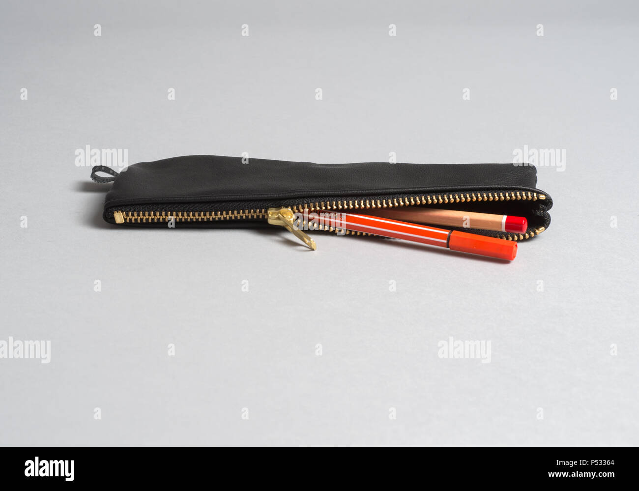 Black pencil case with pens Stock Photo
