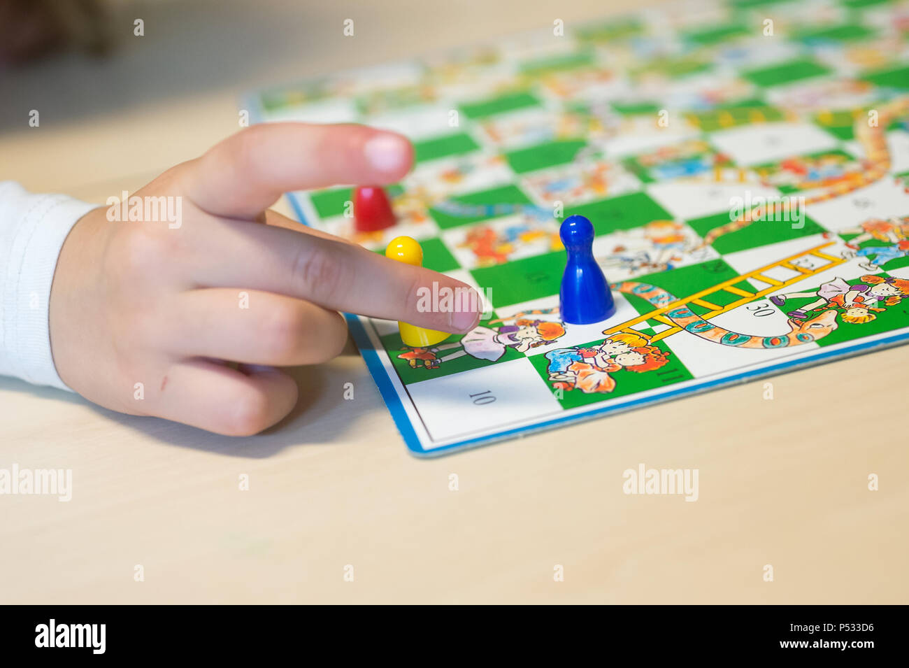 Children at the board game Stock Photo