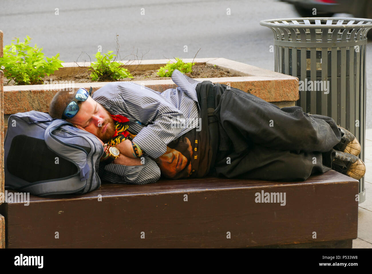 Sleeping fan on a bench street in Moscow at the World Cup Stock Photo