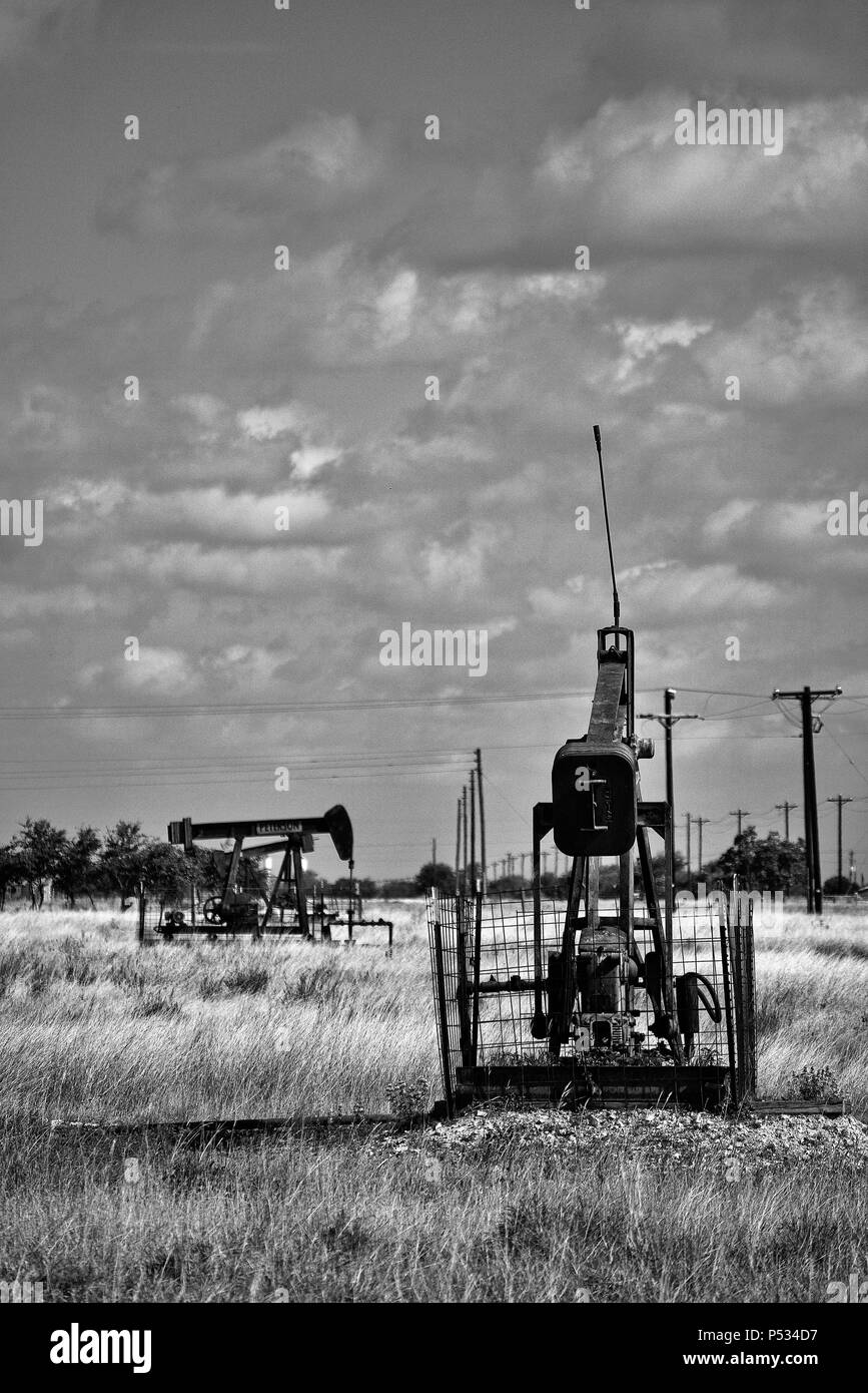 Oil well pump in a field in central Texas Stock Photo