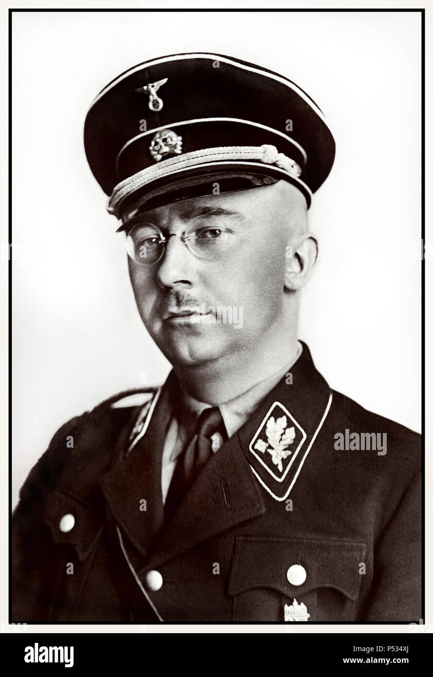 1940's WW2 Heinrich Himmler formal portrait in Waffen SS uniform  German National Socialist Politician Nazi military commander secret police.  Himmler was one of the most powerful men in Nazi Germany and one of the people most directly responsible for the Holocaust. Facilitated genocide across Europe and the east. Committed suicide in 1945 after being captured fleeing under another identity. Stock Photo