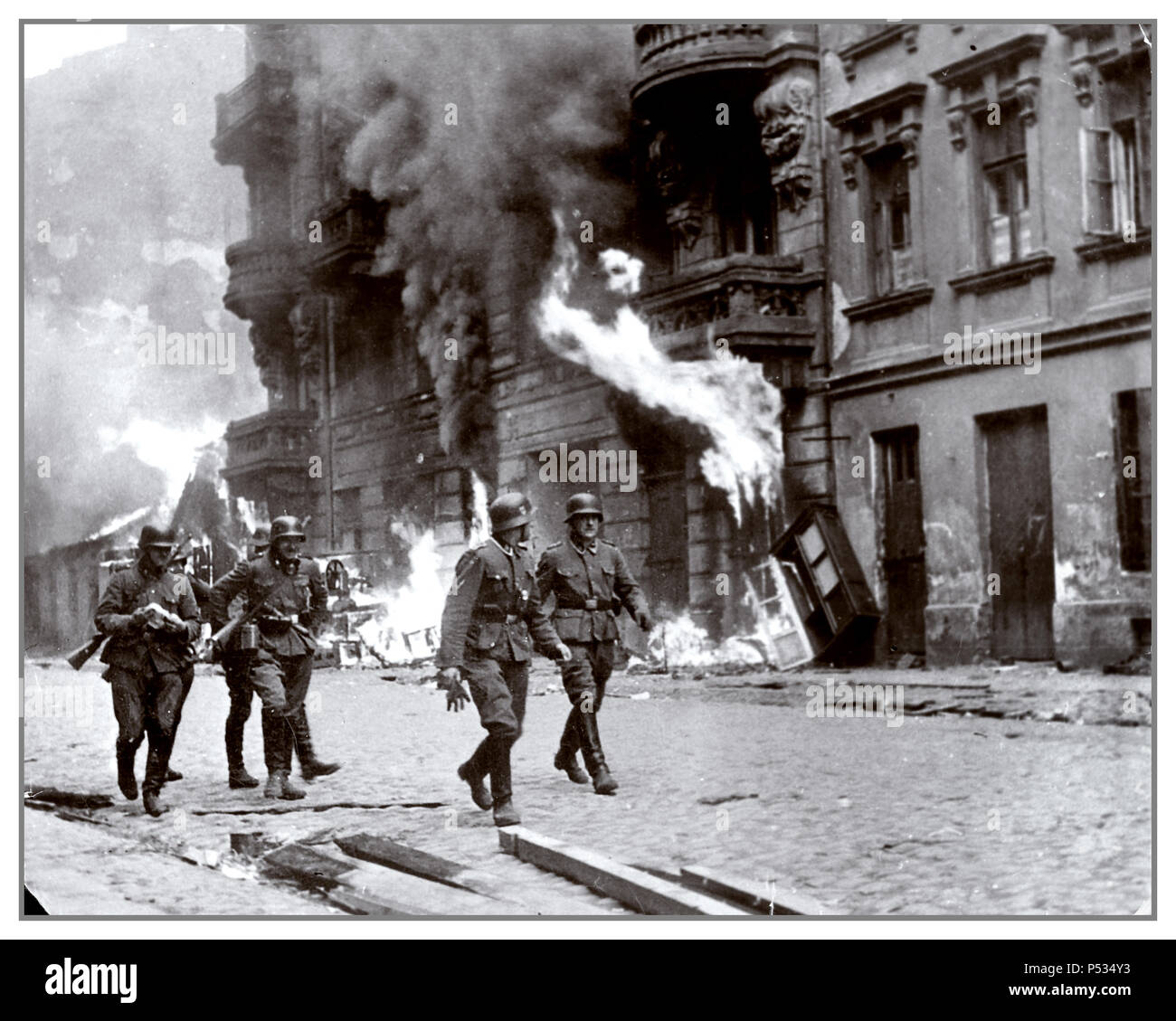 The liquidation of Warsaw Ghetto in May 1943 by Nazi Waffen SS troops. 'The Jewish Quarter of Warsaw is No More!' ..wrote Jürgen Stroop in the STROOP REPORT made for Heinrich Himmler about the brutal inhuman liquidation of Warsaw Ghetto in May 1943 This was a war crime used as evidence by United States Counsel for the Prosecution of Axis Criminality; Nuremberg Germany Stock Photo